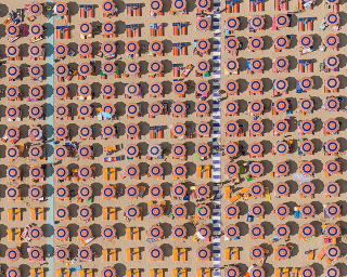 Illustration for article titled Aerial Shots of Beach Show Man Wringing Order From Nature